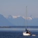 Sailboat Looks To Mainland Mountains